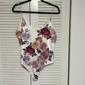 One piece body suit with beautiful flowers on the top sexy